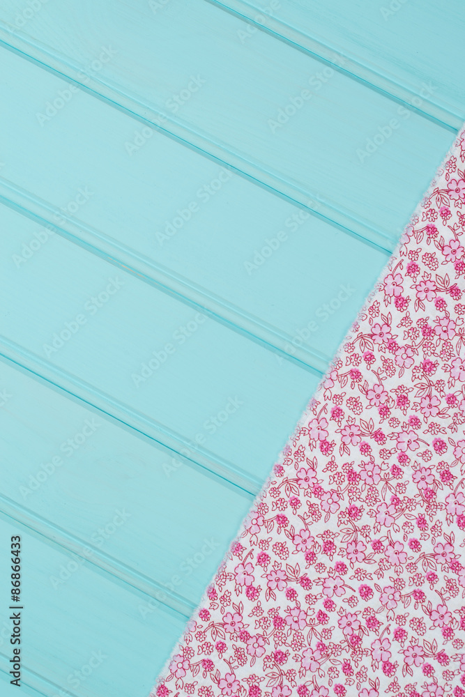 Pink towel over wooden table Pink towel over wooden table