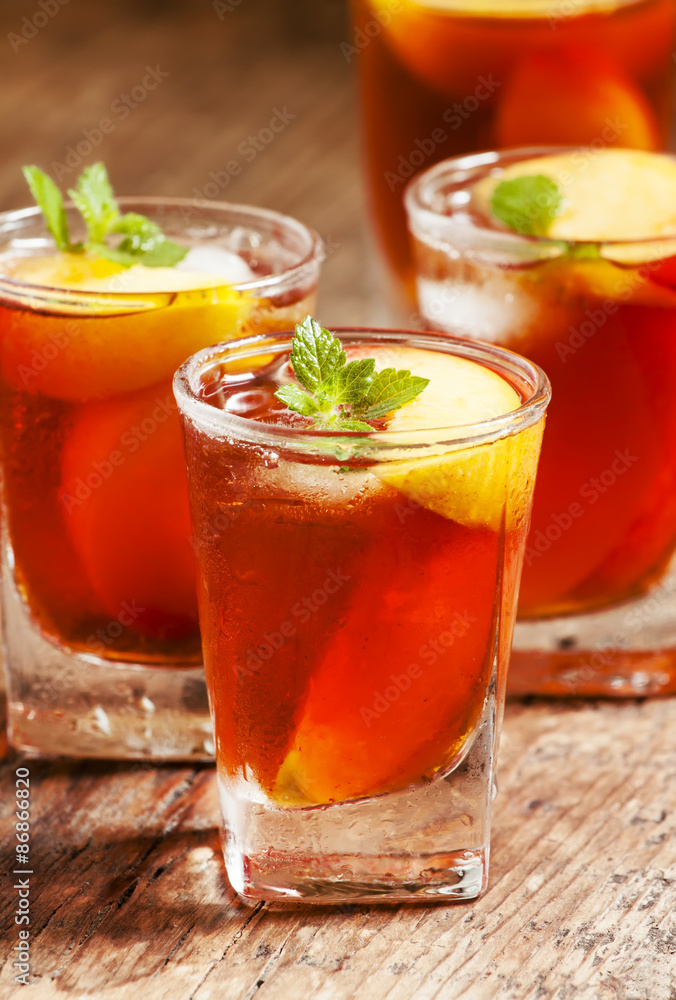 Peach Tea with pieces of fruit and mint on a wooden background, Peach Tea with pieces of fruit and mint on a wooden background,