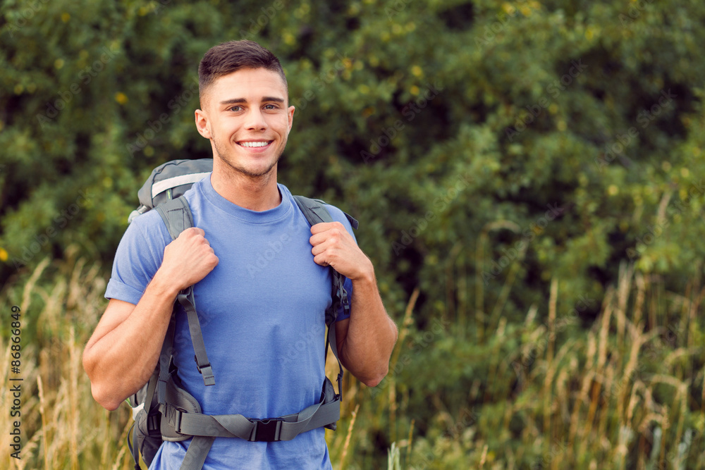 Fototapeta premium Young tourist hiking alone