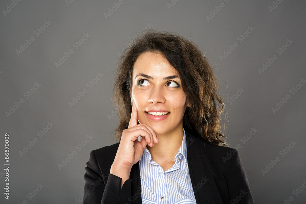 Contemplative smiling businesswoman Contemplative smiling businesswoman