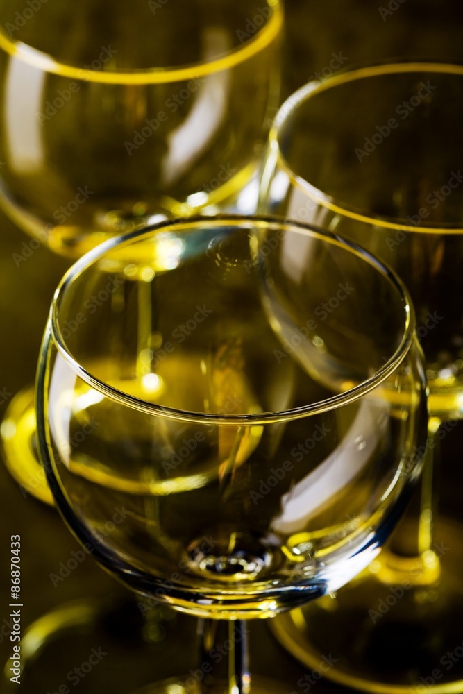 The close up of the wine glass on black
