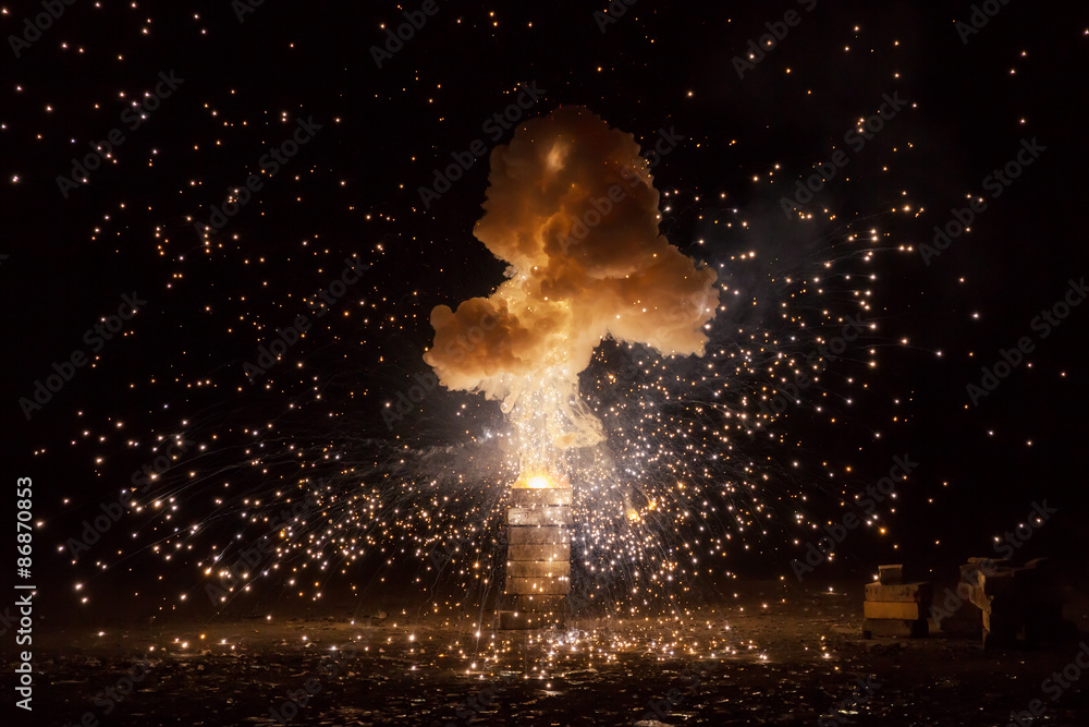 Fototapeta premium Realistic fiery explosion busting over a black background
