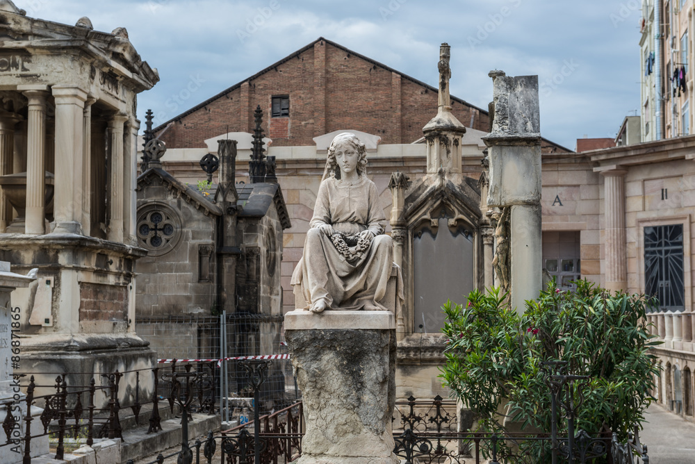 grave sculpture at Poblenou Cemetery in Barcelona, Spain