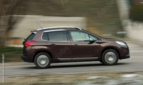 moving small brown car