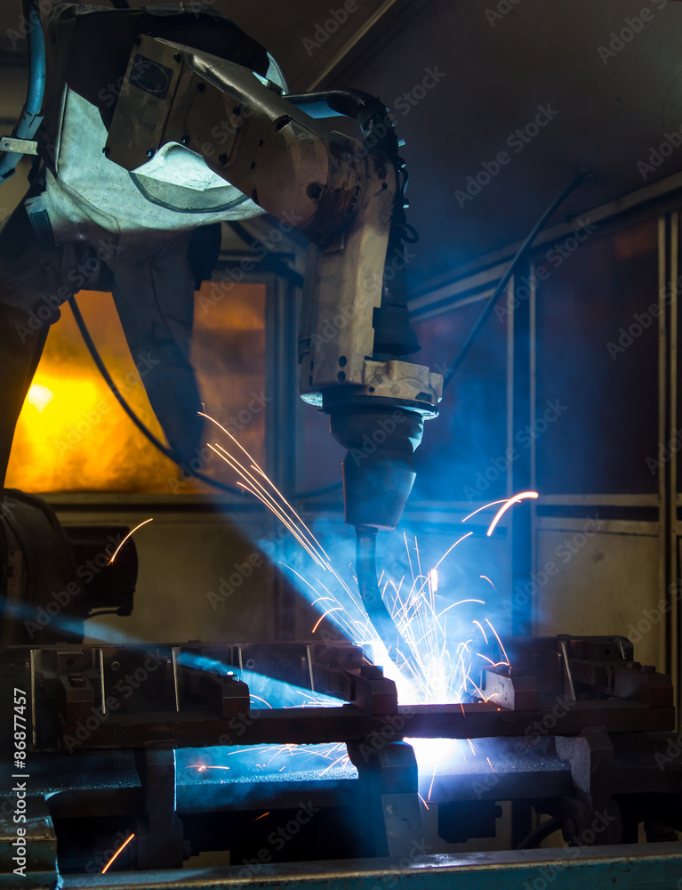 robots welding in a car factory robots welding in a car factory