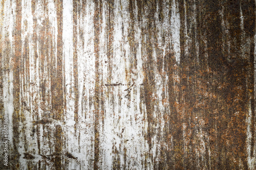 grunge rusty metal texture background with light from corner