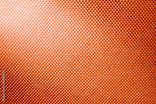 orange fabric nylon background texture with light from corner