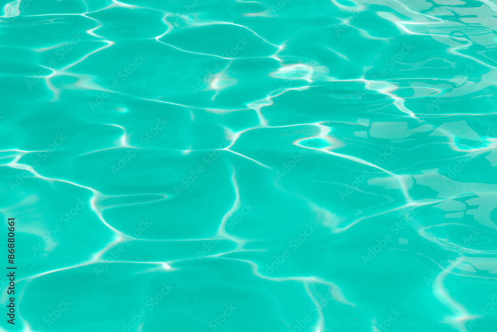 Fototapeta premium green pool water with sun reflections
