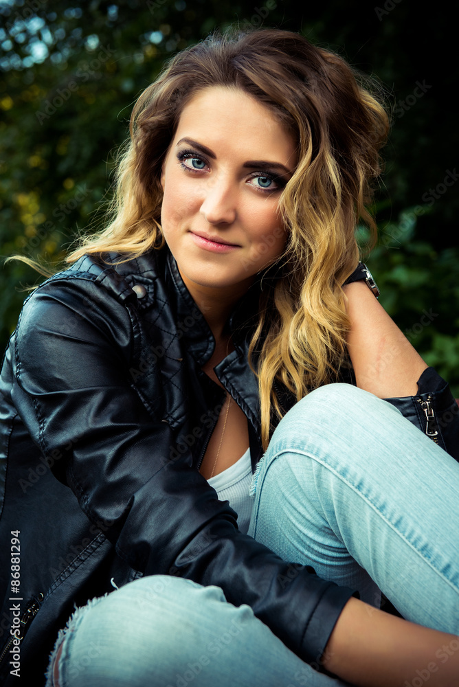 Fashion girl posing with leather jacket Fashion girl posing with leather jacket
