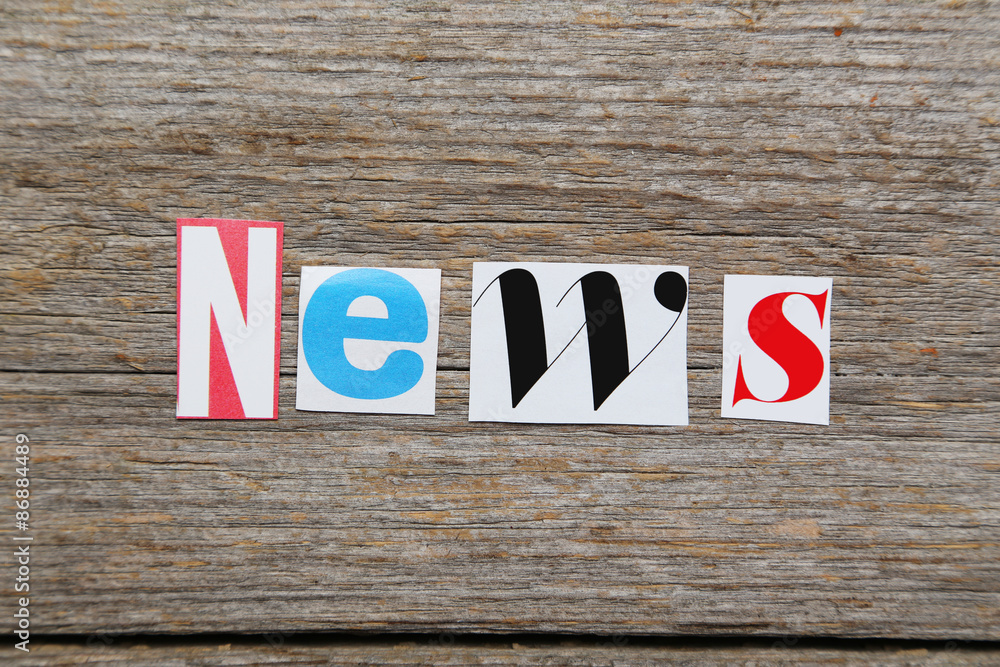 Fototapeta premium The word News in cut out magazine letters