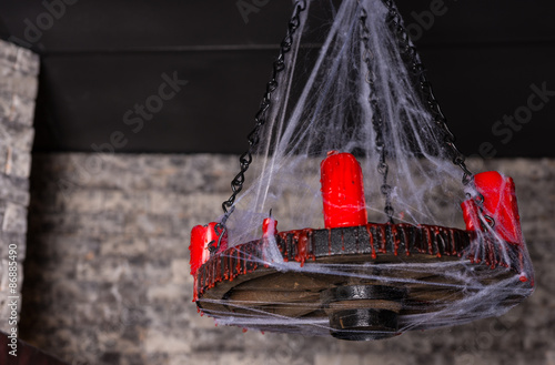 Cobweb Covered Candelabra with Red Candles © kolotype