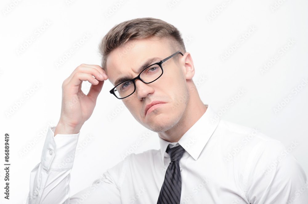 Confused man touching his head with fingers