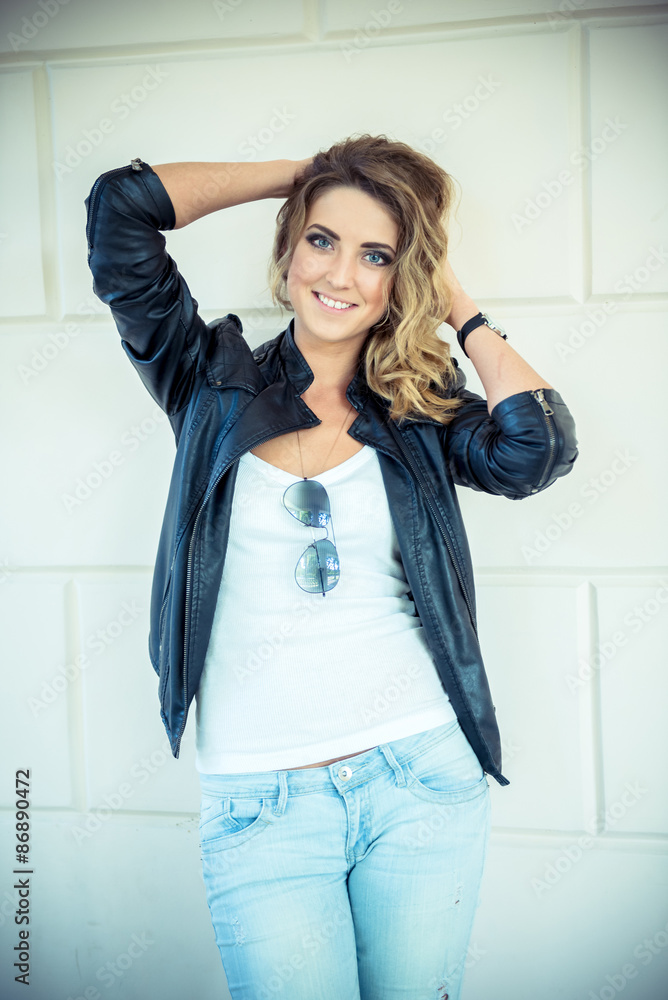 Fashion girl posing with leather jacket Fashion girl posing with leather jacket