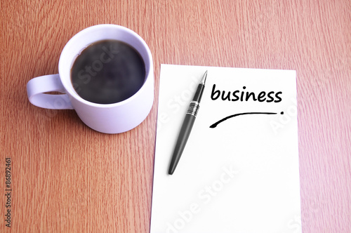 Coffee, pen and notes write business