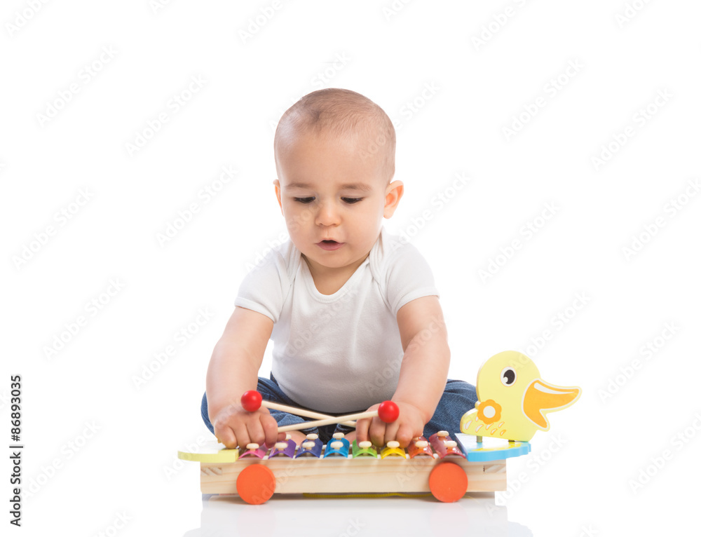 Adorable baby enjoy and playing percussion Adorable baby enjoy and playing percussion