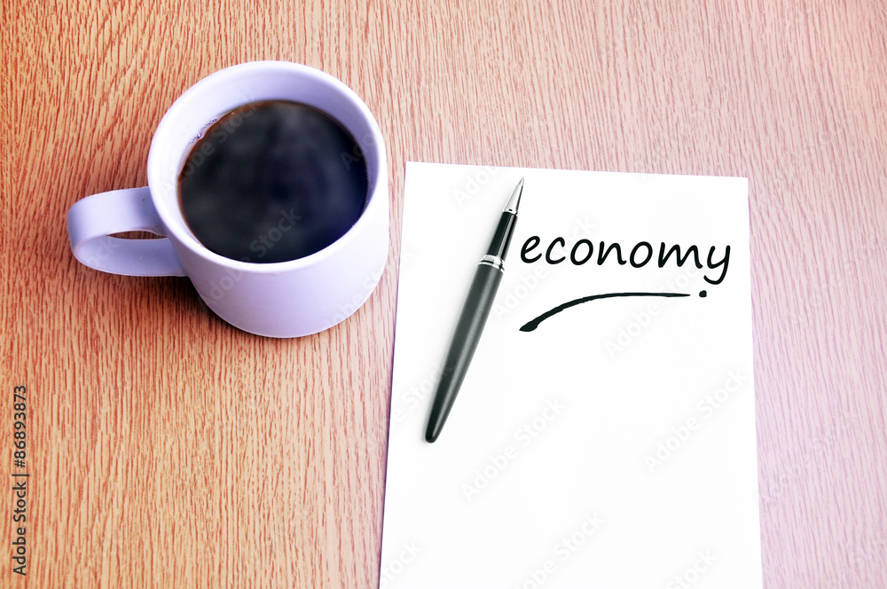 Coffee, pen and notes write economy Coffee, pen and notes write economy