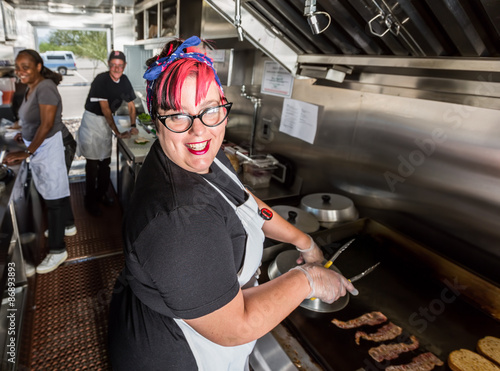 Chef Grills Bacon On a Food Truck