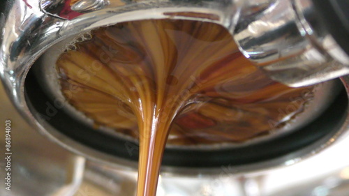 Espresso brewing from bottomless portafilter in 4K photo