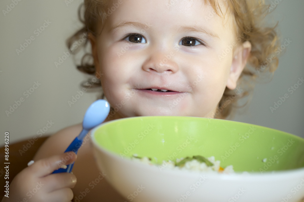 Portrait of smiling child eating Portrait of smiling child eating