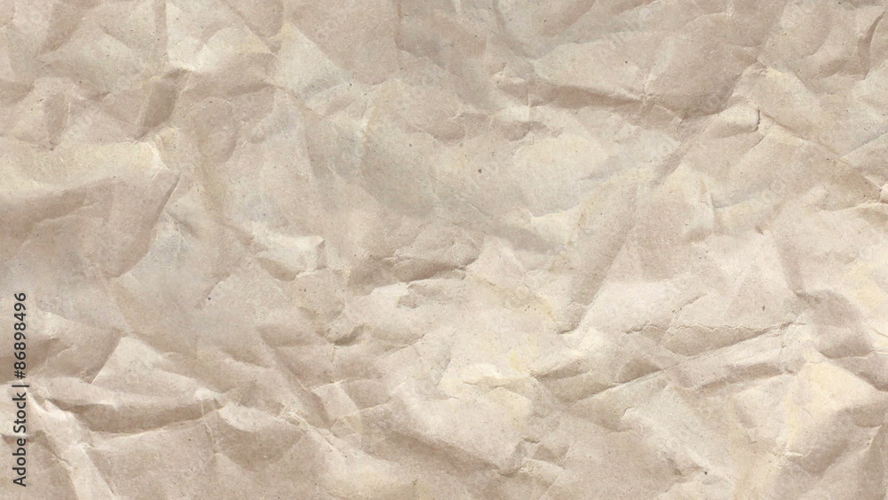 Wrinkled Newsprint Paper Texture A dynamic, wrinkled, brown paper