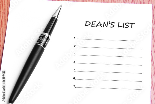 Pen  and notes paper with deans list