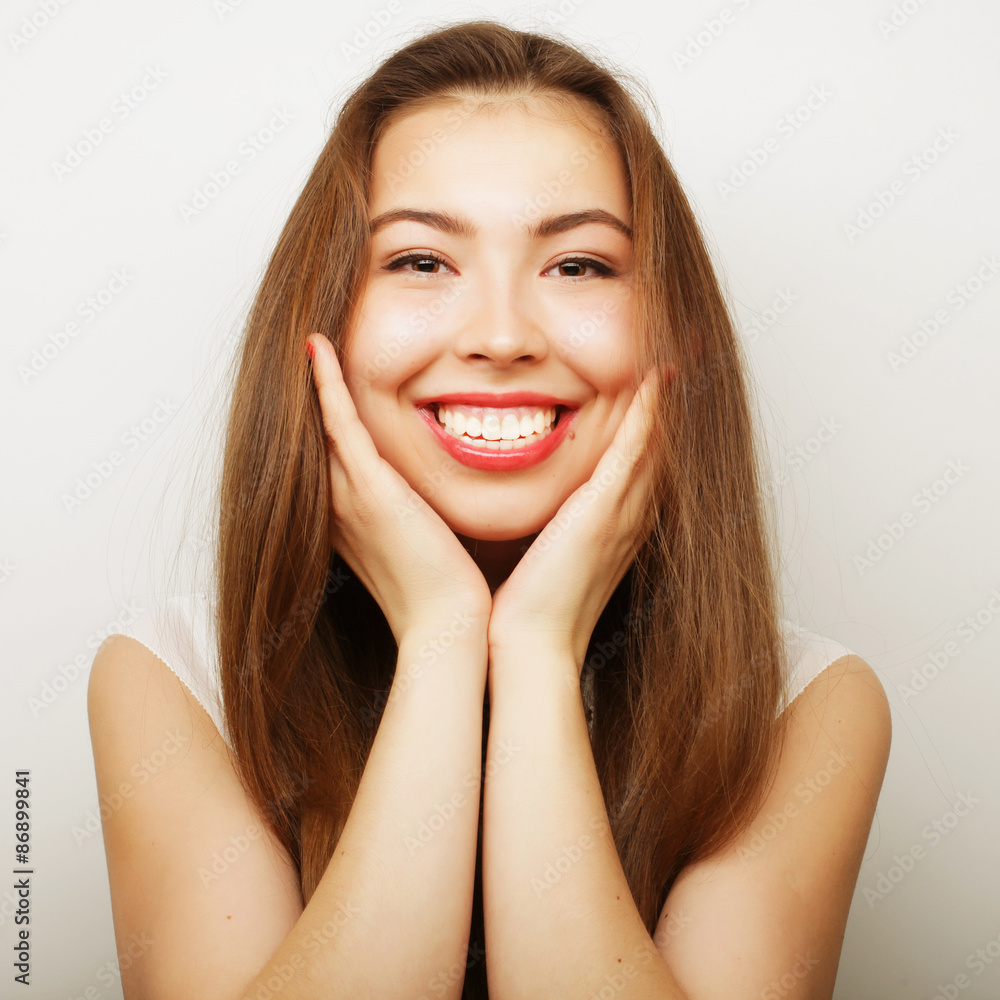 Beautiful young surprised woman. Studio shot. Beautiful young surprised woman. Studio shot.