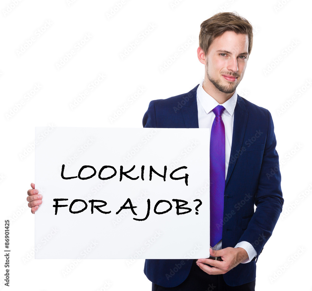 Man with white banner presenting phrase of looking for a job Man with white banner presenting phrase of looking for a job