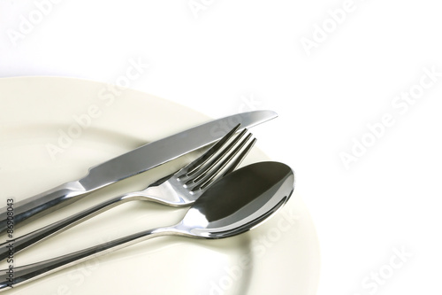 close up dinning silverware fork   spoon and knife with dish 