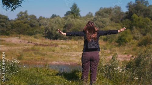 Girl spread Her Arms on the Shore photo