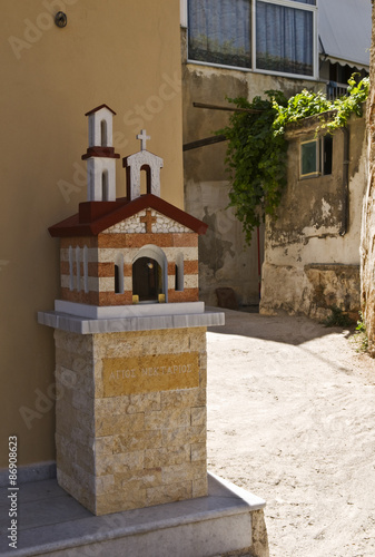 Kandylakia, a Greek Mini-Chapel. Kandylakia is a tiny chapel built by the side of the road or in a city as a public praying place. It is a shrine built in the shape of a small Orthodox chapel. photo