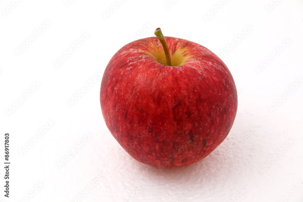 Red ripe apple on white background.