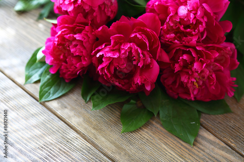 Red peonies on the boards © Olha Afanasieva