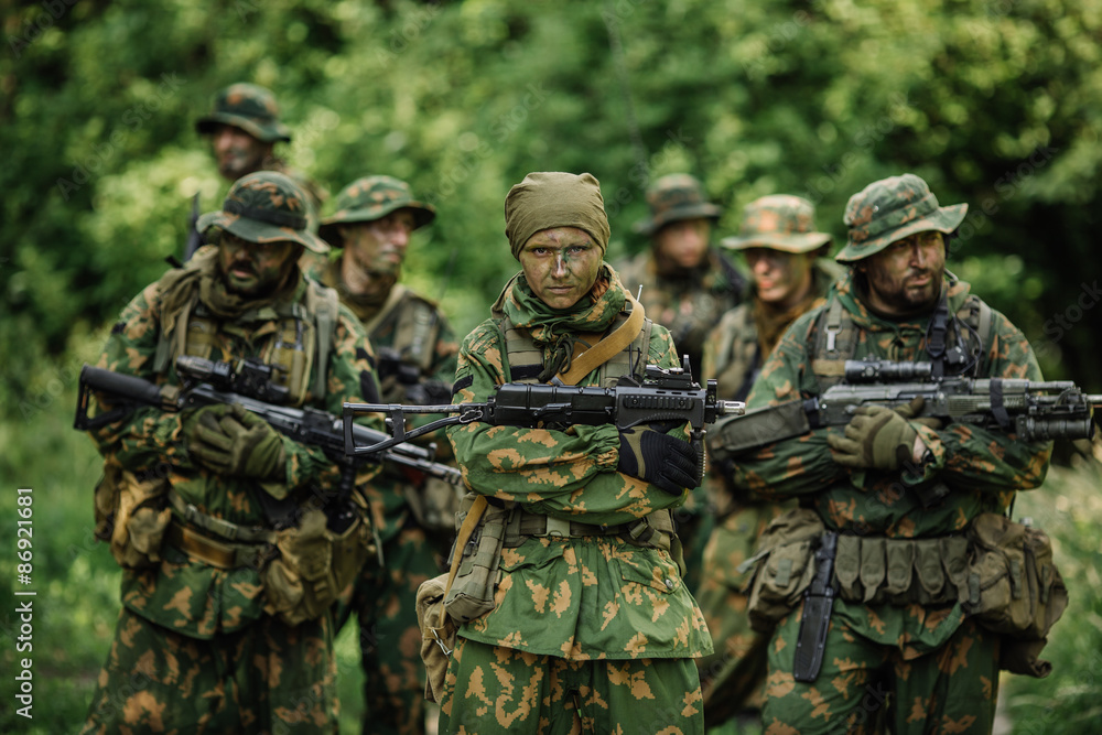 Group of soldiers special forces during the raid in the forest Group of soldiers special forces during the raid in the forest