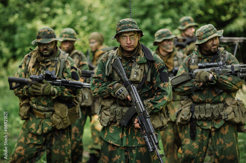 Group of soldiers special forces during the raid in the forest