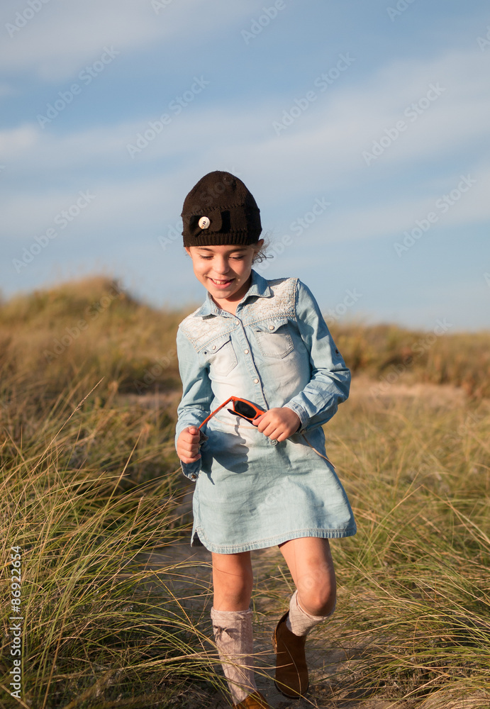 Shy little girl on the beach