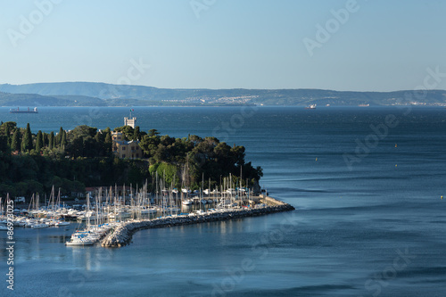 Miramar Castle on Adriatic sea with marina photo