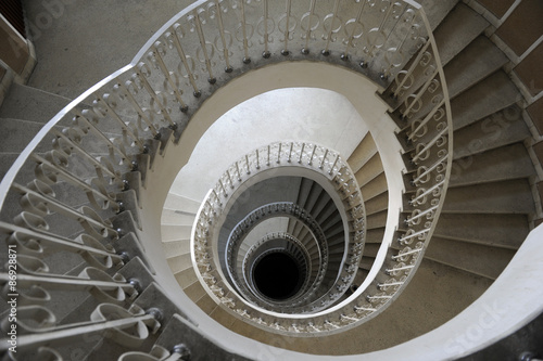 Spiral staircase in a building with many levels