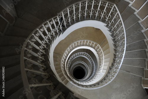 Spiral staircase in a building with many levels