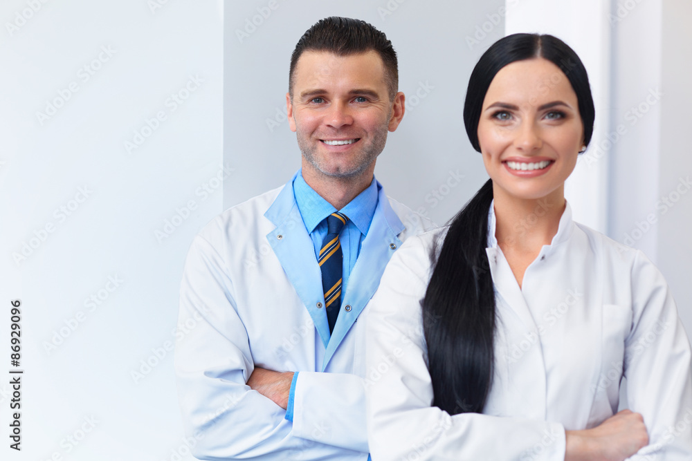 Dentist Team at Dental Clinic. Two Smiling Doctors at their Work Dentist Team at Dental Clinic. Two Smiling Doctors at their Work