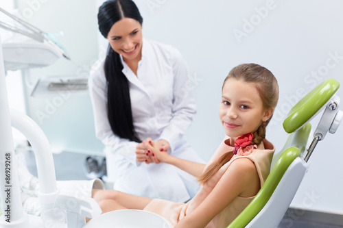 Dentist and Patient in Dentist Office. Child in the Dental Chair