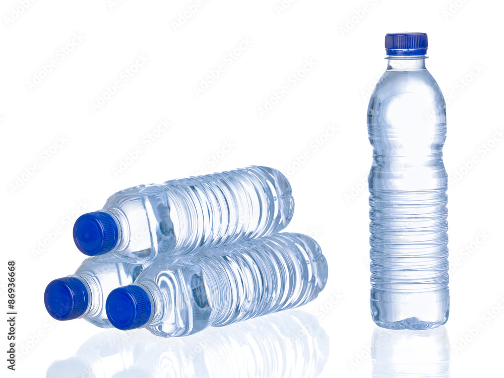 Bottles of water stacked and standing isolated on white background Bottles of water stacked and standing isolated on white background
