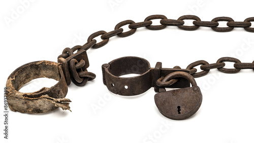 Rusty old shackles with padlock and padded shackles used for locking up prisoners or slaves between 1600 and 1800.