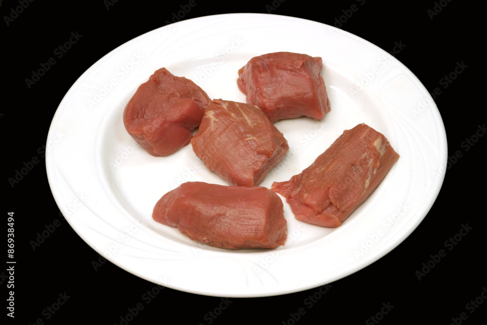 Meat on a white plate