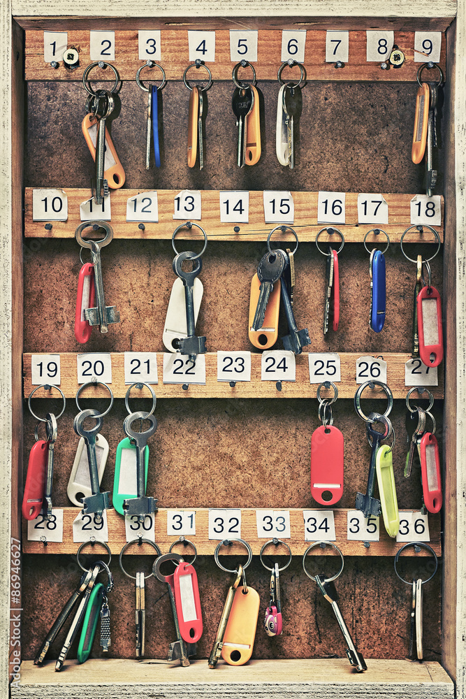 keys to the doors hung on a wooden board keys to the doors hung on a wooden board
