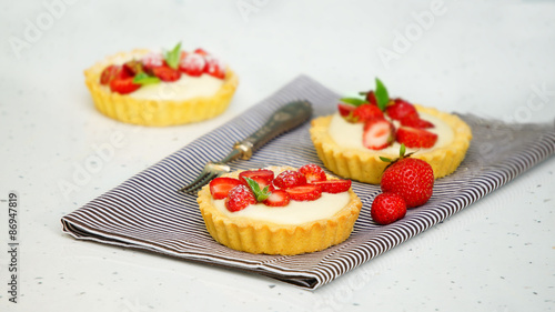 tartlets with custard and berries