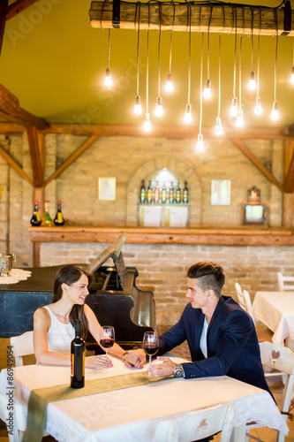 Young couple drinking red wine