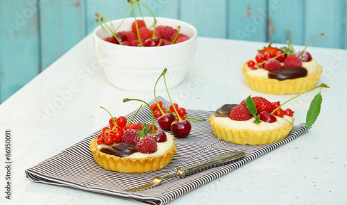 tartlets with custard and berries