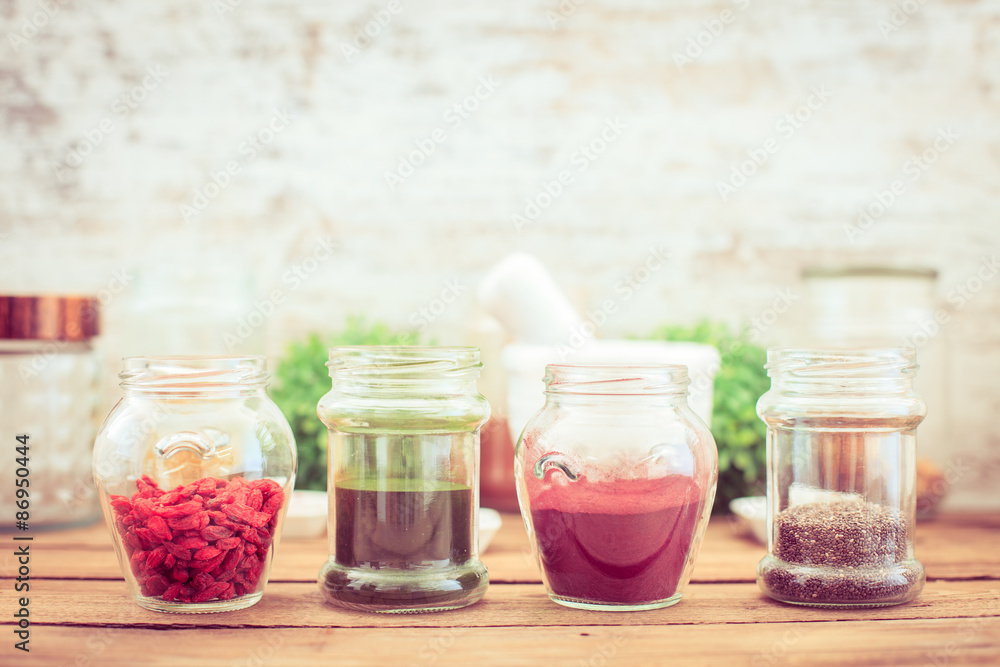 Goji,chia, aroina and spirulina (superfood) on wooden tabe Goji,chia, aroina and spirulina (superfood) on wooden tabe