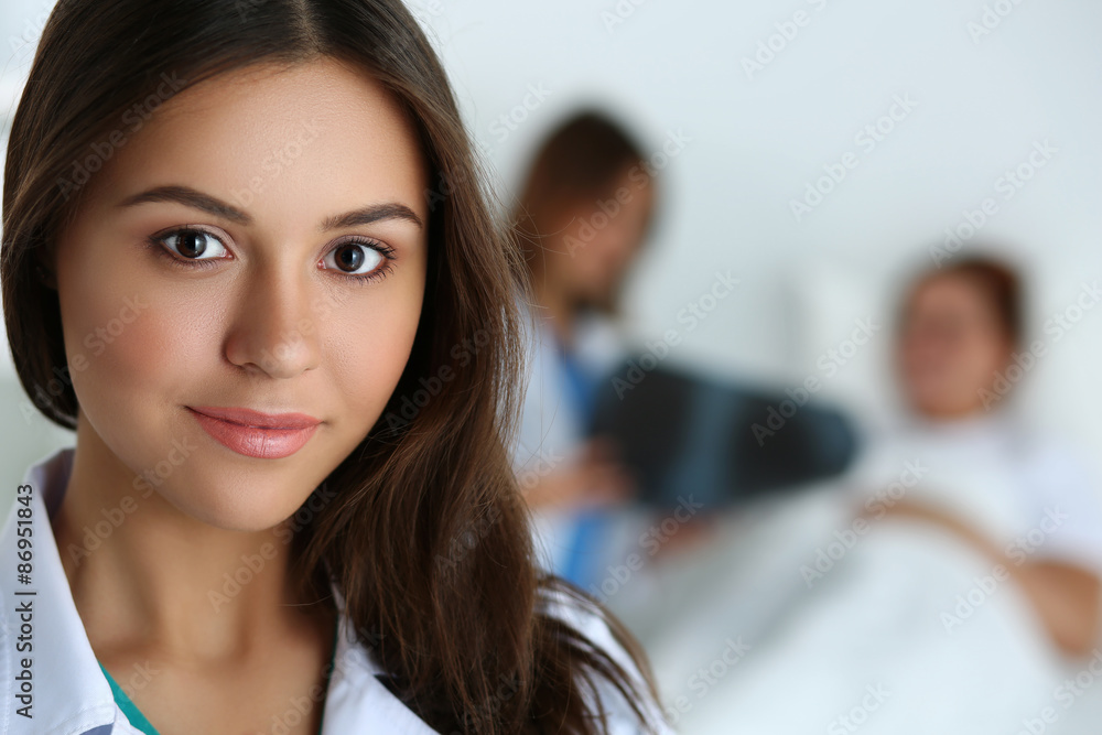 Beautiful female medicine doctor looking in camera Beautiful female medicine doctor looking in camera