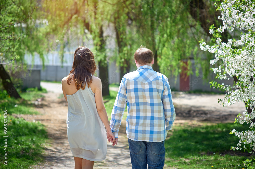 couple in love walking along the path